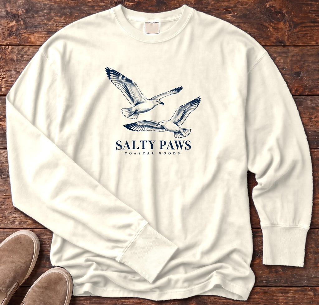Gull Flight Coastal Goods Long Sleeve Tee in Ivory, Salty Paws Comfort Colors Long Sleeve Tee, front design flat lay
