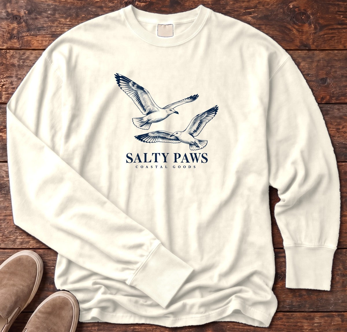 Gull Flight Coastal Goods Long Sleeve Tee in Ivory, Salty Paws Comfort Colors Long Sleeve Tee, front design flat lay