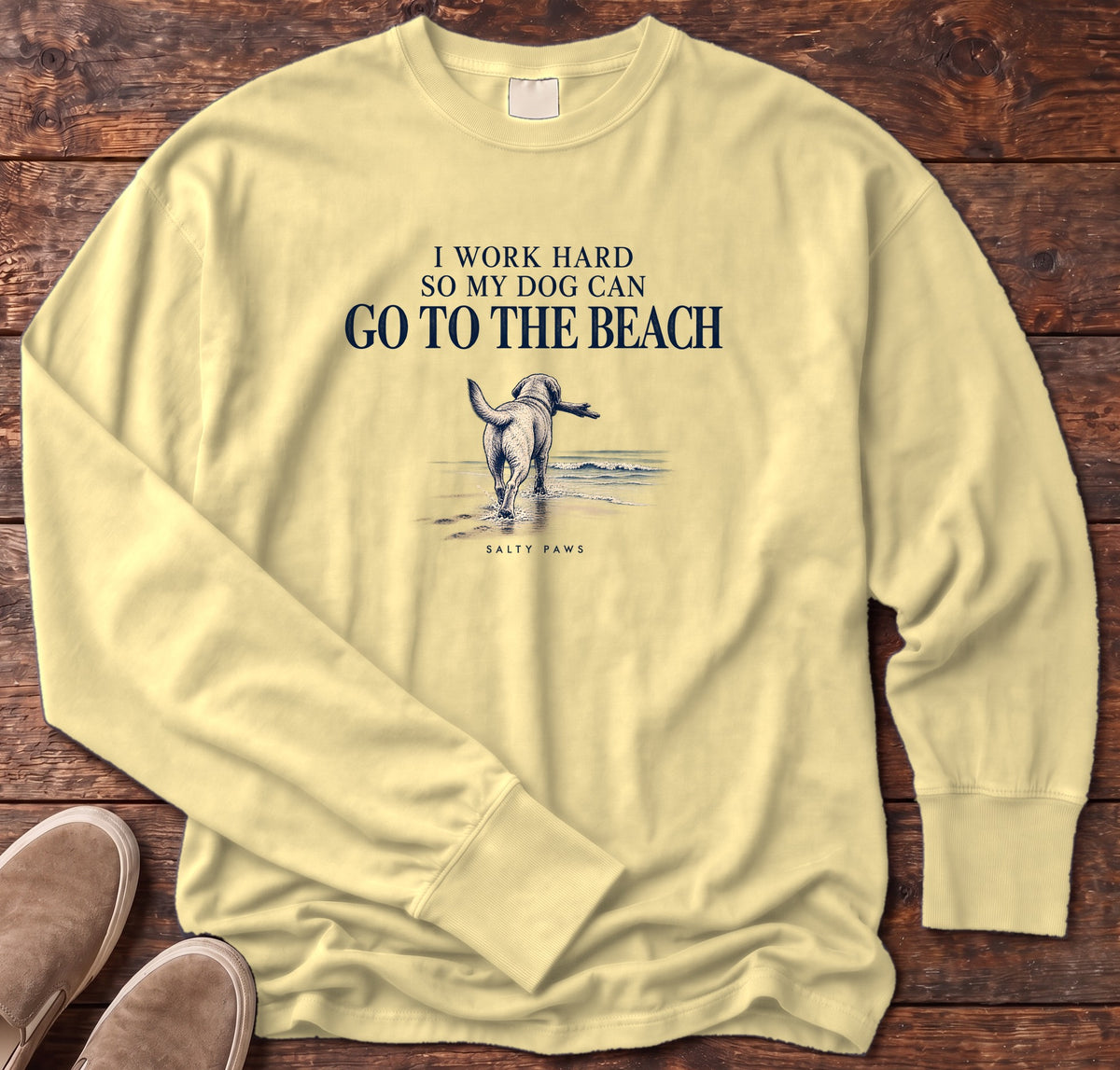 I Work Hard So My Dog Can Go to the Beach Long Sleeve Tee in Butter, Salty Paws Comfort Colors Long Sleeve Tee, front design flat lay