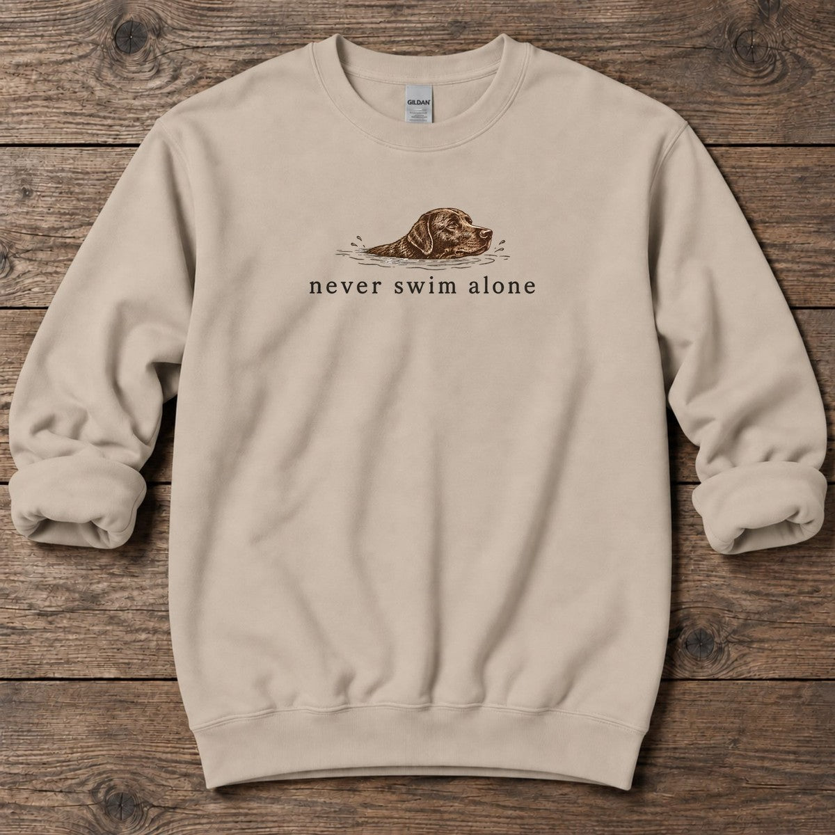 Never Swim Alone Chocolate Lab Midweight Sweatshirt in Sand, front design flat lay