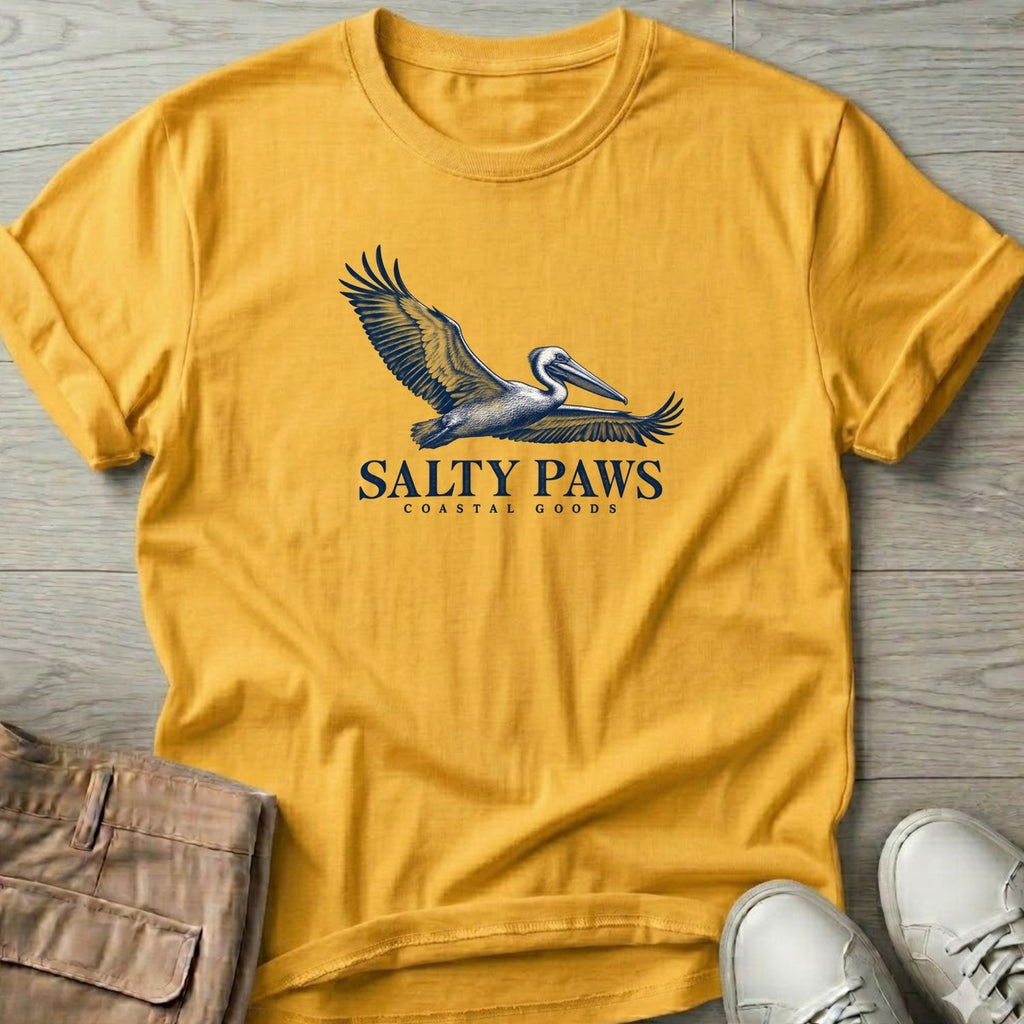 Gliding Pelican Coastal Goods T-Shirt in Daisy, Salty Paws T-Shirt, front design flat lay
