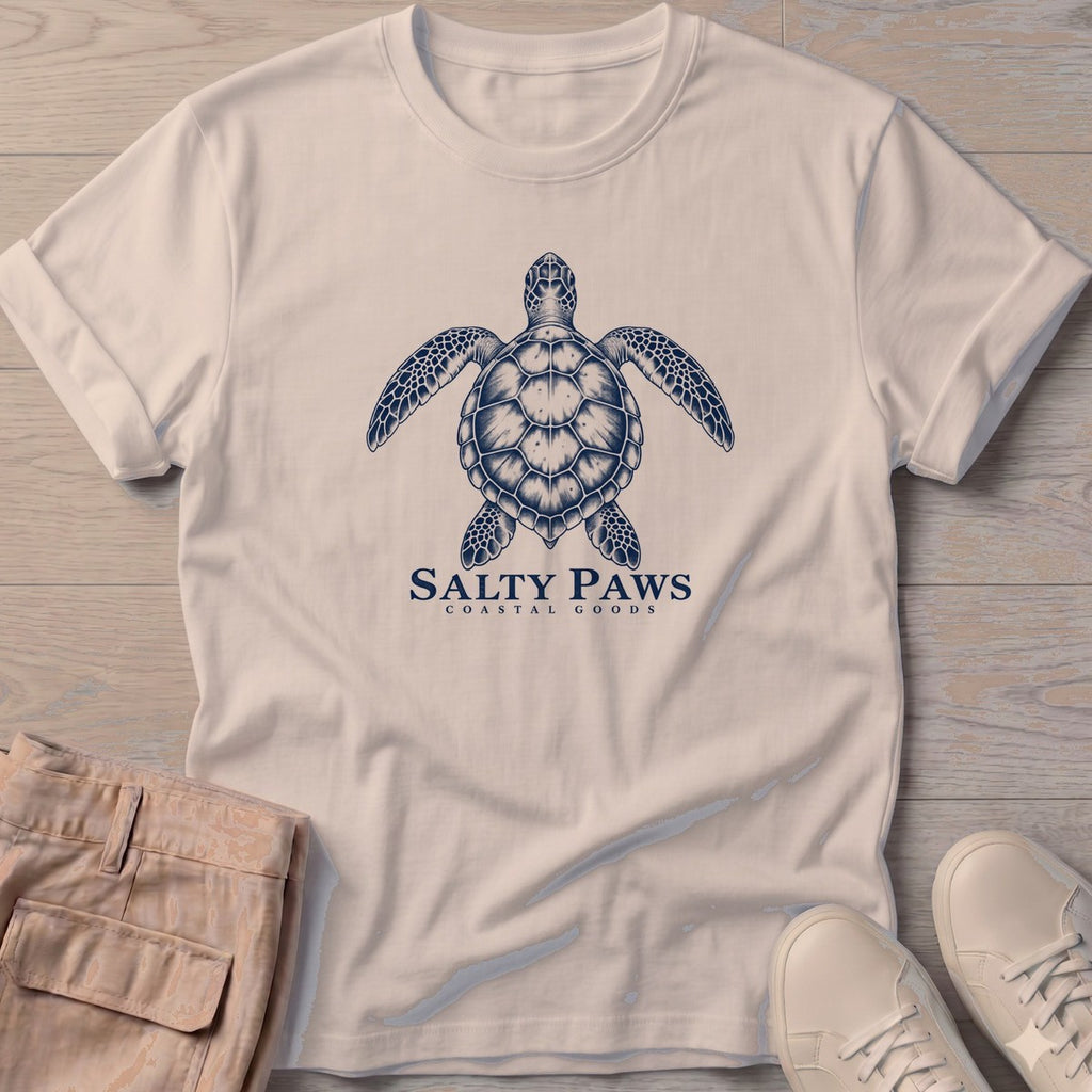 Sea Turtle Coastal Goods T-Shirt in Sand, Salty Paws T-Shirt, front design flat lay