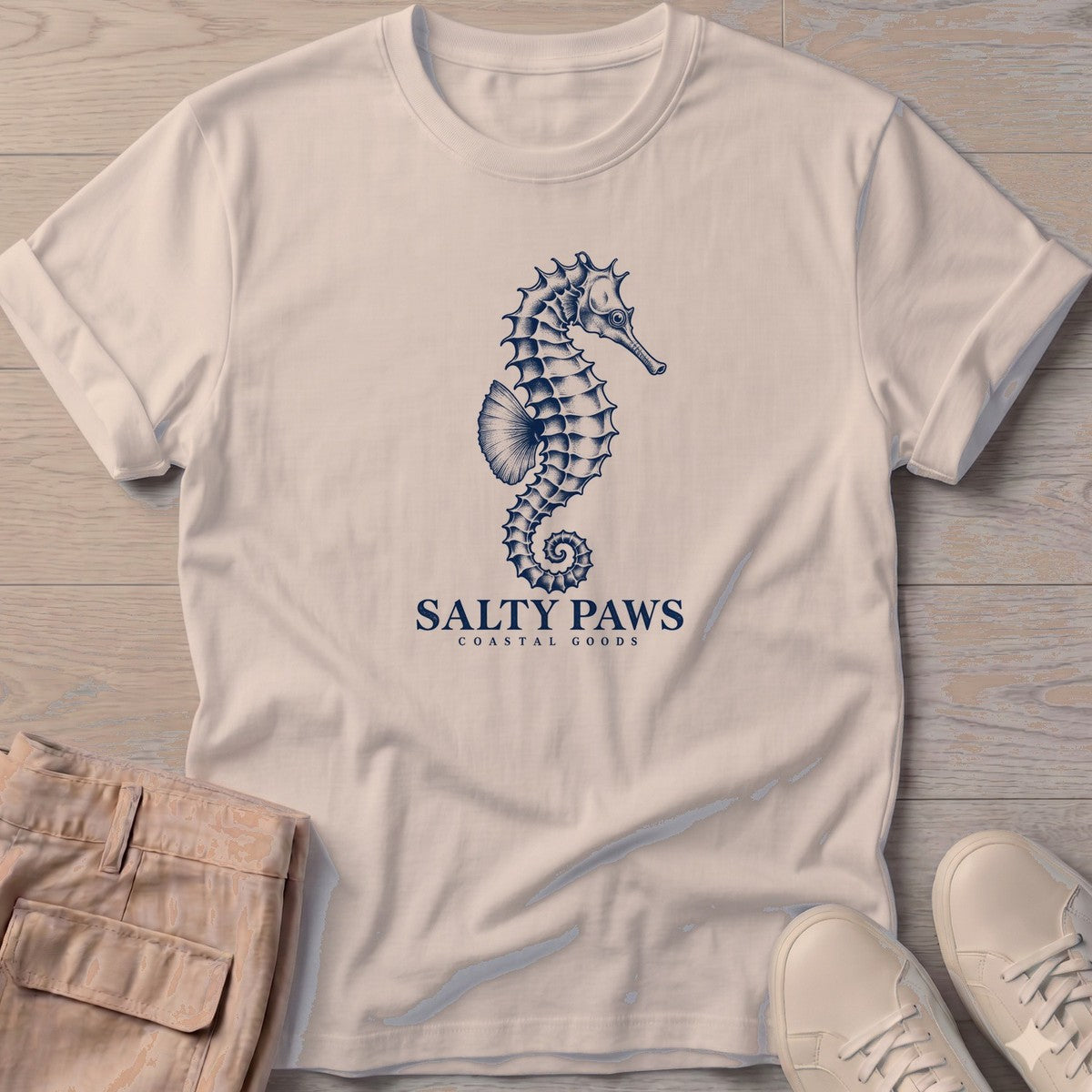Seahorse Coastal Goods T-Shirt in Sand, Salty Paws T-Shirt, front design flat lay