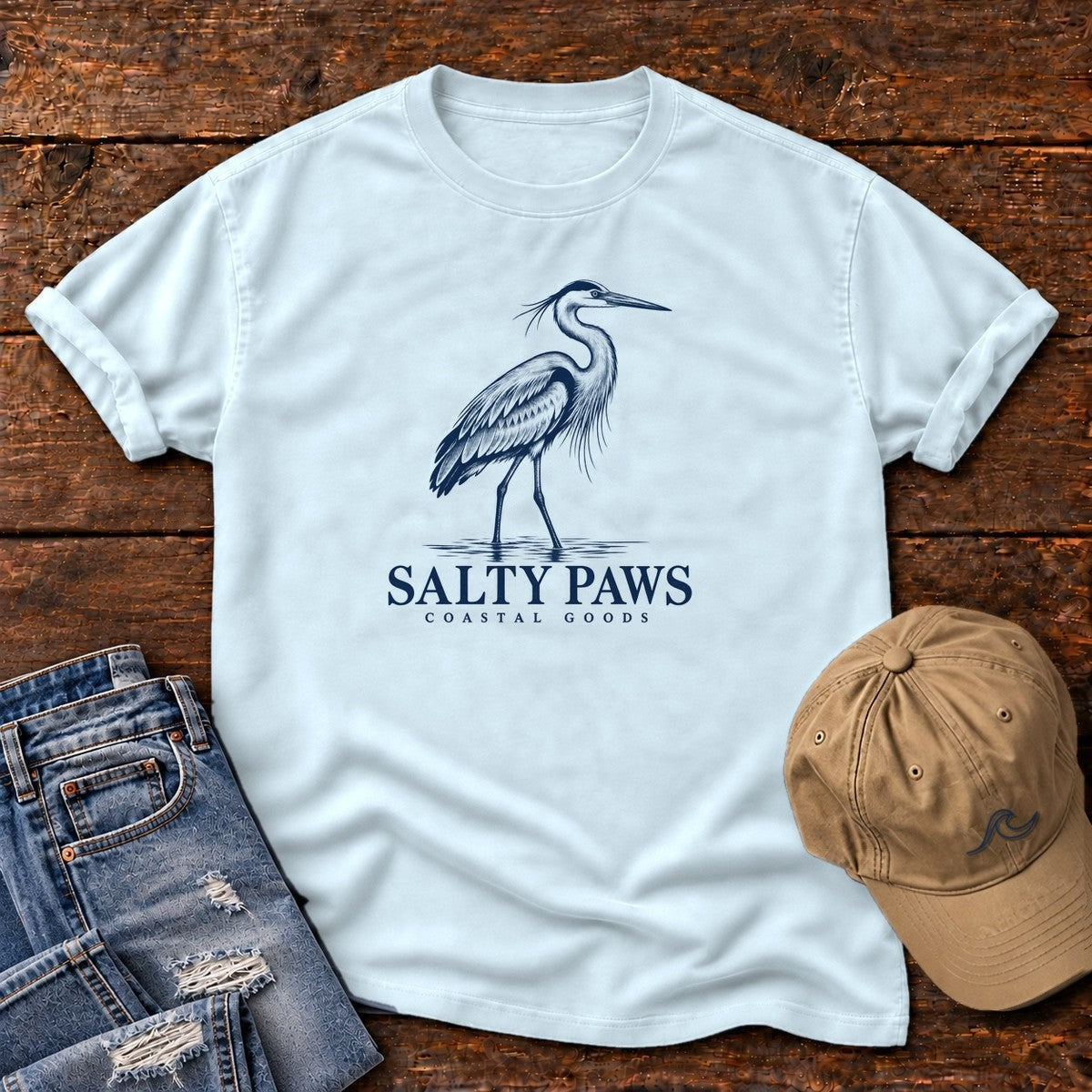 Great Blue Heron Coastal Goods T-Shirt in Chambray, Salty Paws Comfort Colors T-Shirt, front design flat lay