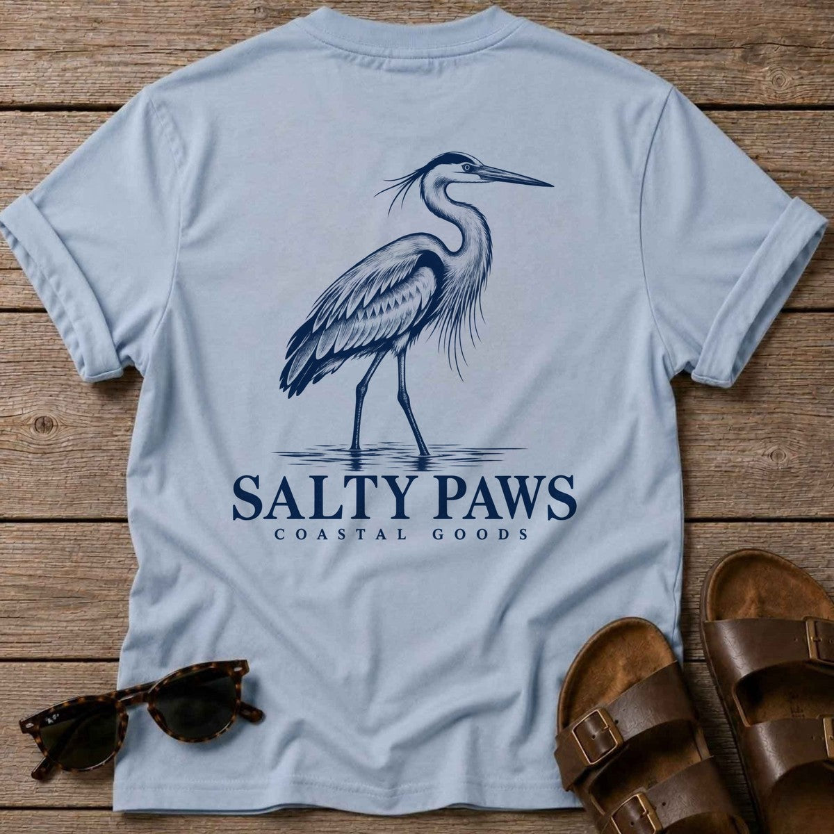 Great Blue Heron Coastal Goods Back Design T-Shirt in Light Blue, Salty Paws T-Shirt, back design flat lay