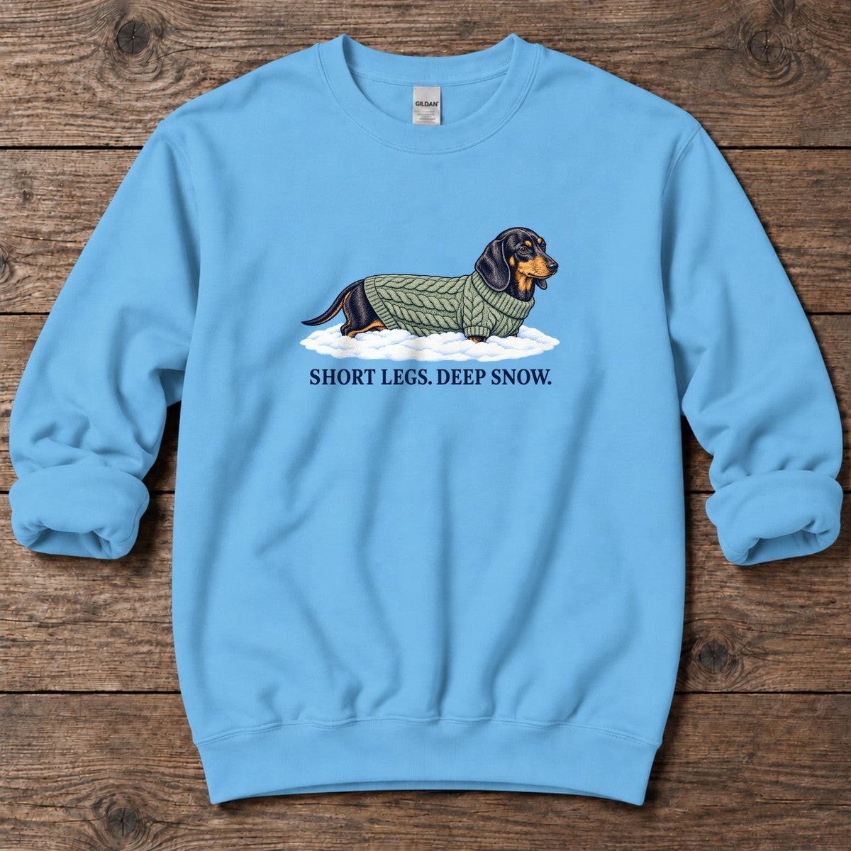 Short Legs Deep Snow Dachshund Midweight Sweatshirt in Sky, Salty Paws Midweight Sweatshirt, front design flat lay