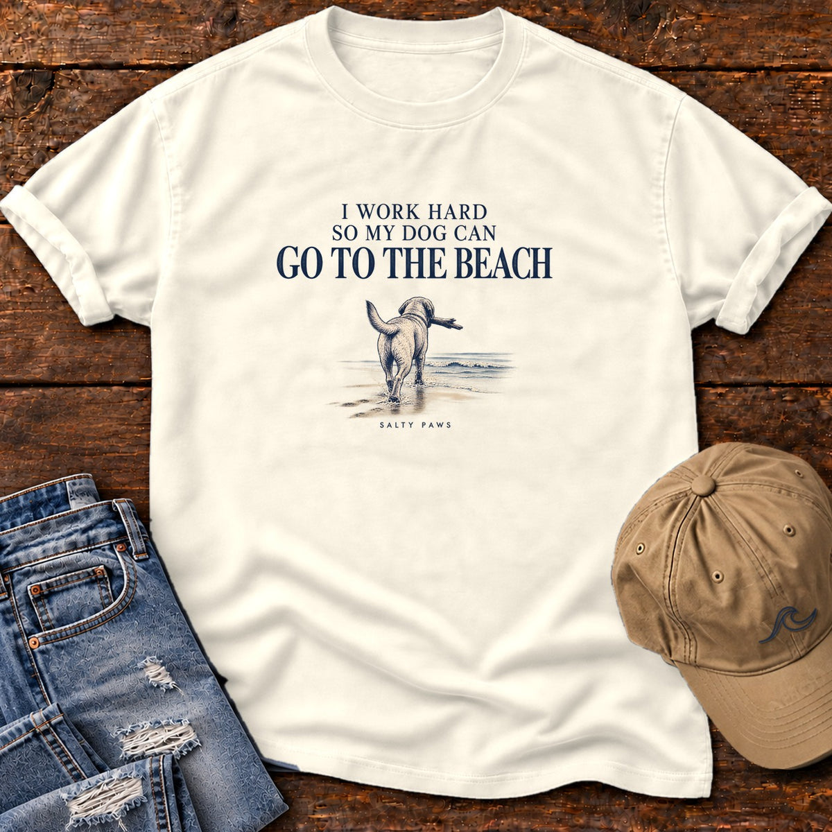 I Work Hard So My Dog Can Go to the Beach T-Shirt in Ivory, Salty Paws Comfort Colors T-Shirt, front design flat lay