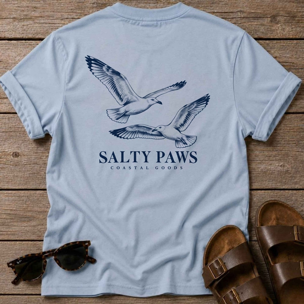 Gull Flight Coastal Goods Back Design T-Shirt in Light Blue, Salty Paws T-Shirt, back design flat lay