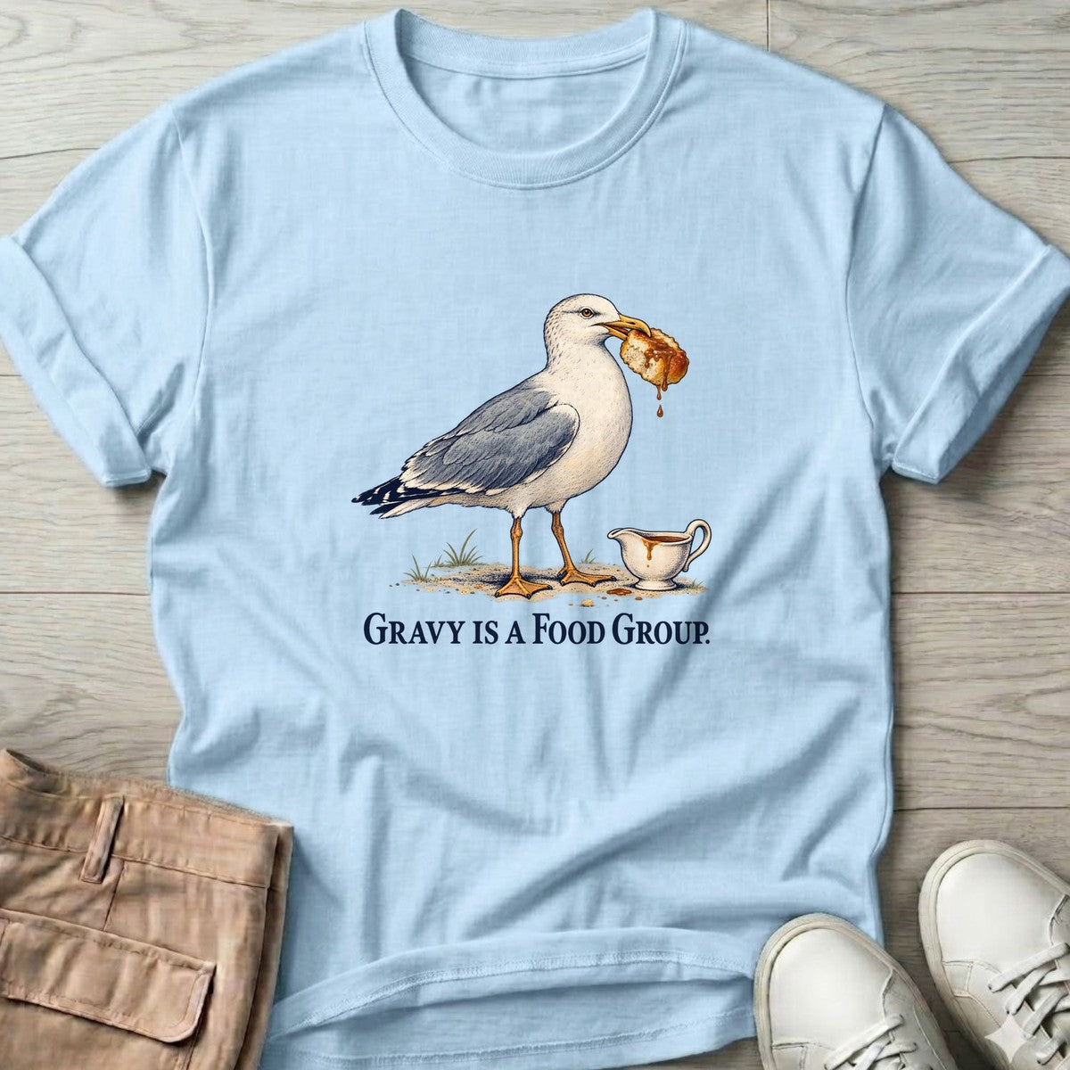 Gravy Is a Food Group Seagull T-Shirt in Light Blue, Salty Paws T-Shirt, front design flat lay