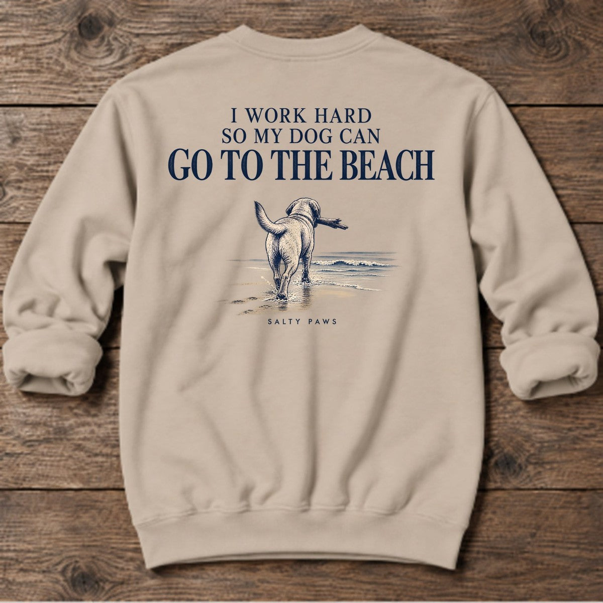 I Work Hard So My Dog Can Go to the Beach Back Design Midweight Sweatshirt in Sand, Salty Paws Midweight Sweatshirt, back design flat lay