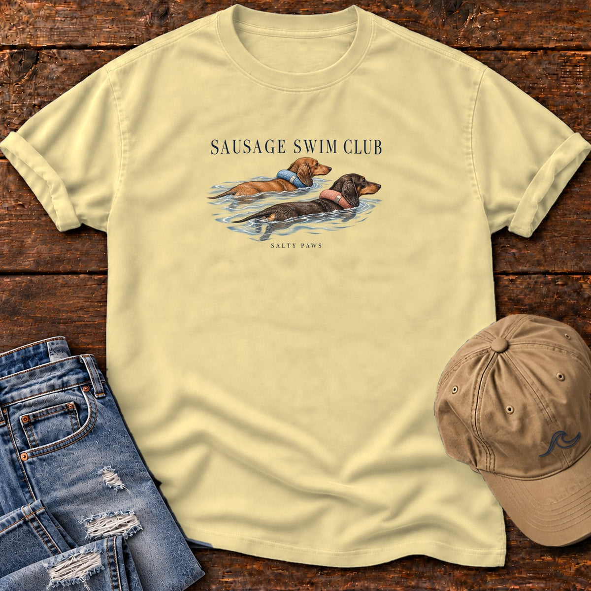 Sausage Swim Club Dachshunds T-Shirt in Butter, Salty Paws Comfort Colors T-Shirt, front design flat lay