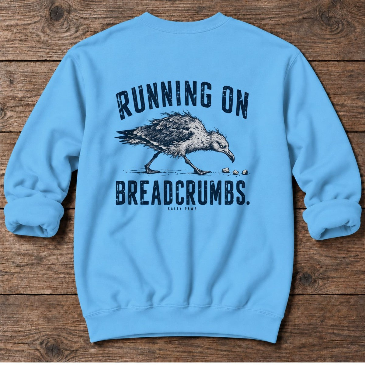 Running on Breadcrumbs Seagull Back Design Midweight Sweatshirt in Sky, Salty Paws Midweight Sweatshirt, back design flat lay