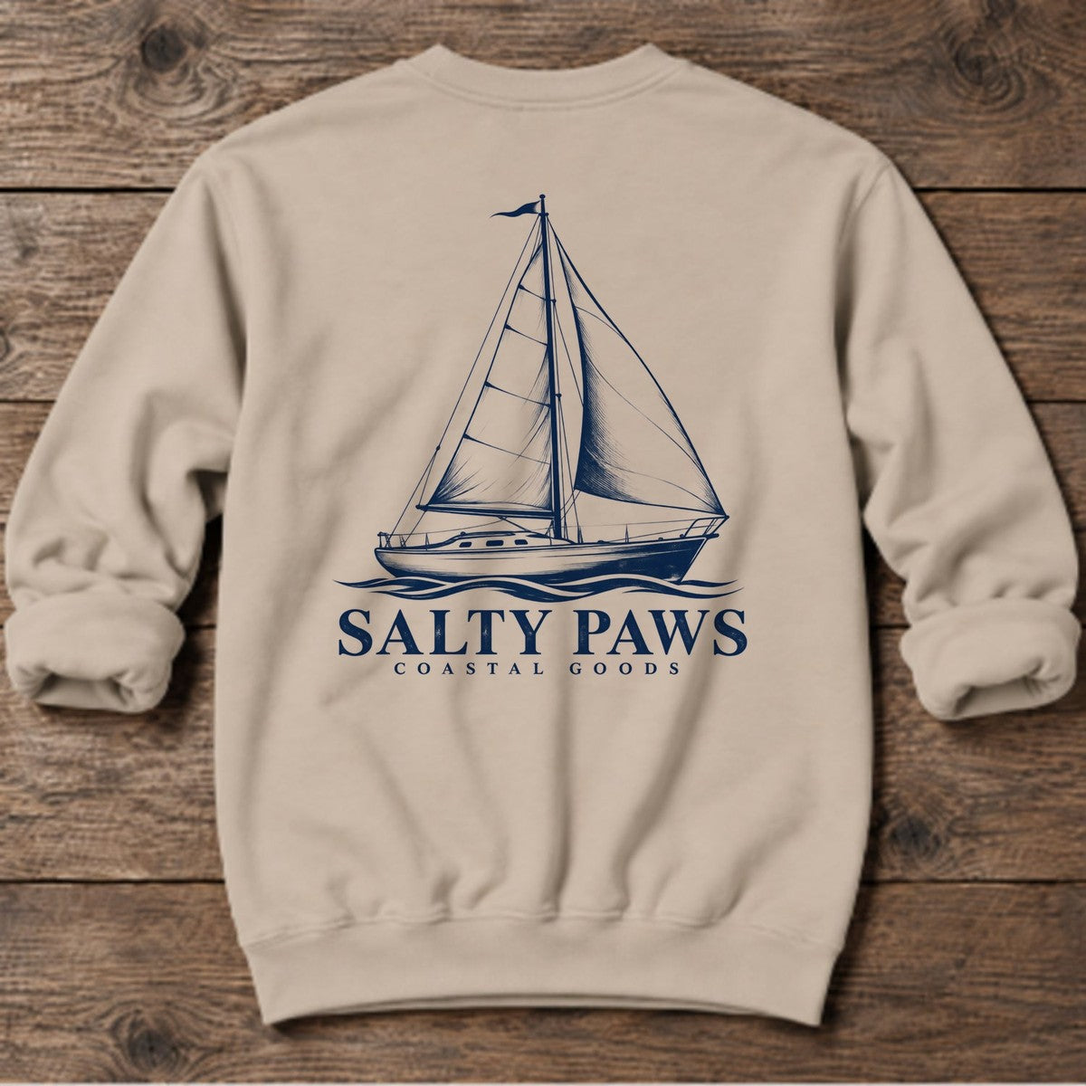 Sailboat Coastal Goods Back Design Midweight Sweatshirt in Sand, Salty Paws Midweight Sweatshirt, back design flat lay