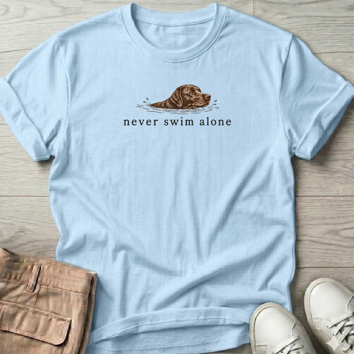 Never Swim Alone Chocolate Lab T-Shirt in Light Blue, front design flat lay