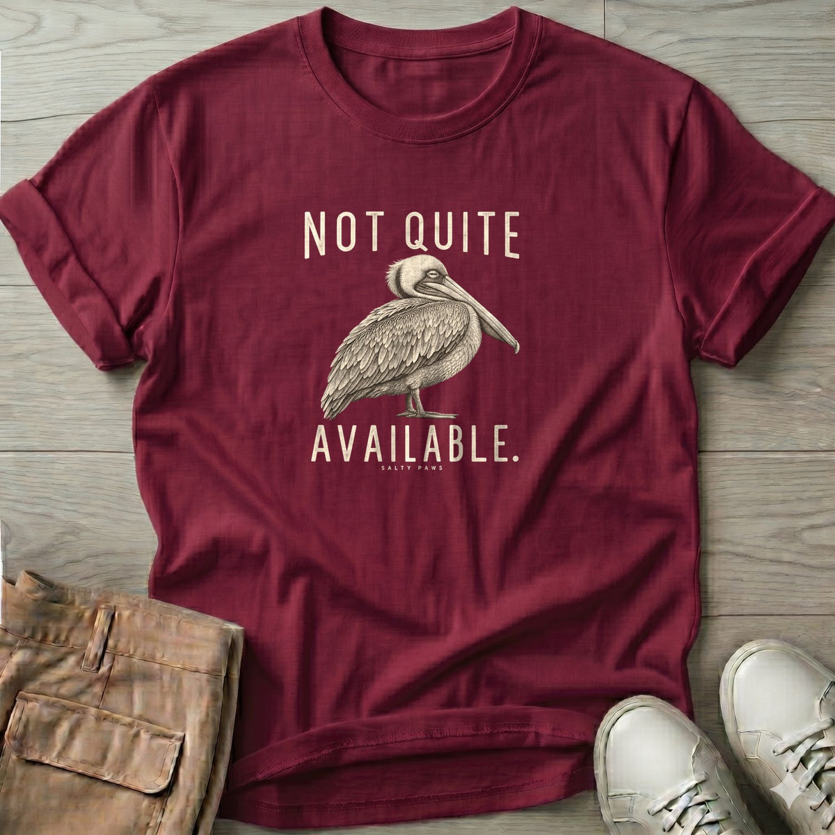 Not Quite Available Pelican T-Shirt in Maroon, Salty Paws T-Shirt, front design flat lay