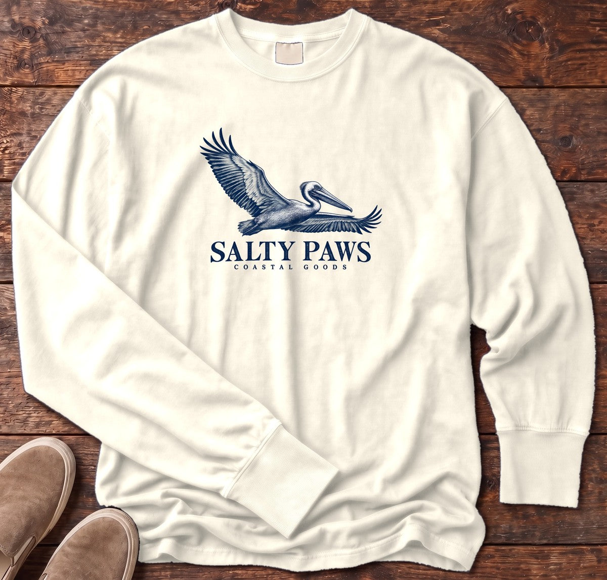 Gliding Pelican Coastal Goods Long Sleeve Tee in Ivory, Salty Paws Comfort Colors Long Sleeve Tee, front design flat lay