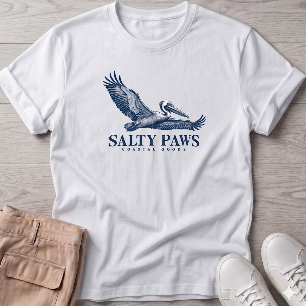 Gliding Pelican Coastal Goods T-Shirt in White, Salty Paws T-Shirt, front design flat lay