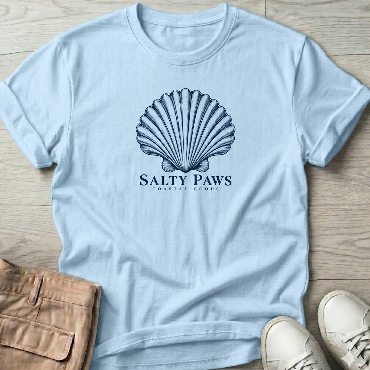 Scallop Shell Coastal Goods T-Shirt in Light Blue, Salty Paws T-Shirt, front design flat lay
