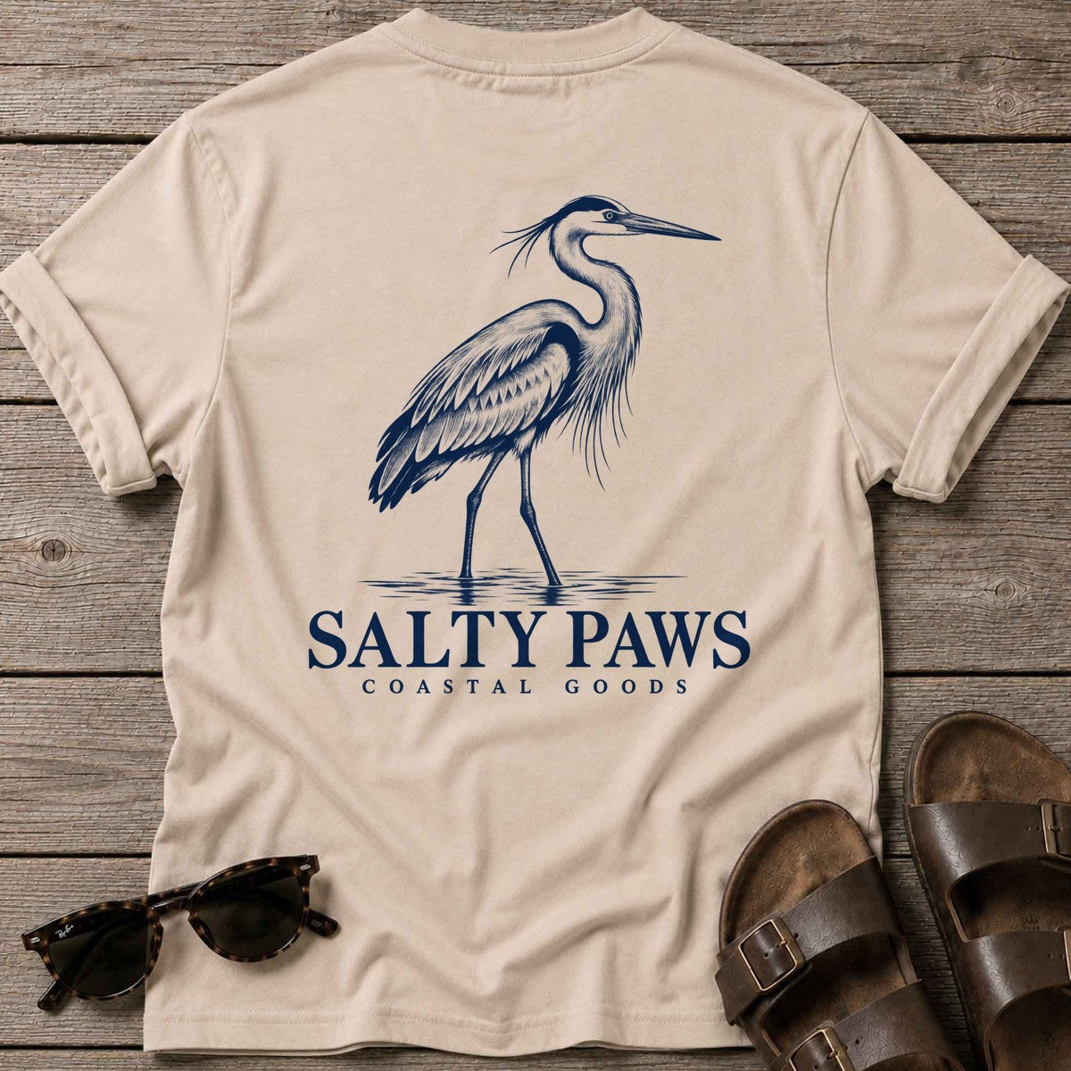 Great Blue Heron Coastal Goods Back Design T-Shirt in Sand, Salty Paws T-Shirt, back design flat lay