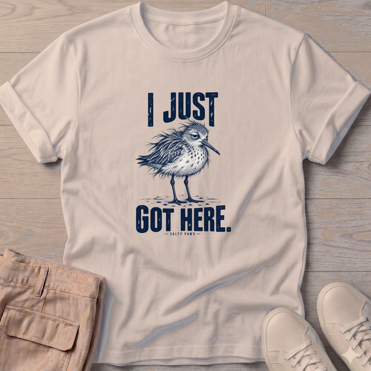 I Just Got Here Sandpiper T-Shirt in Sand, Salty Paws T-Shirt, front design flat lay
