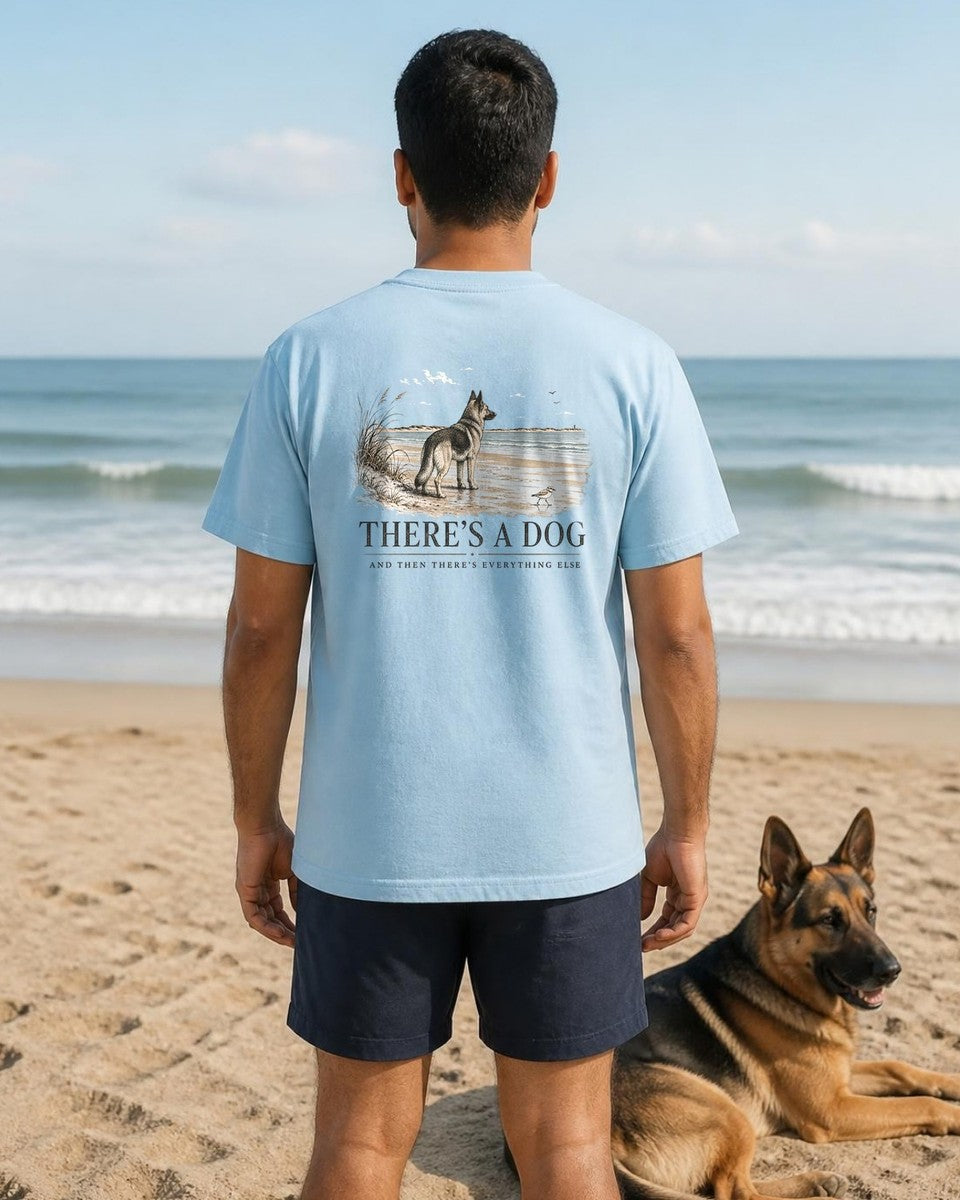 There's a Dog Shepherd Comfort Colors T-Shirt in Chambray, worn by a model