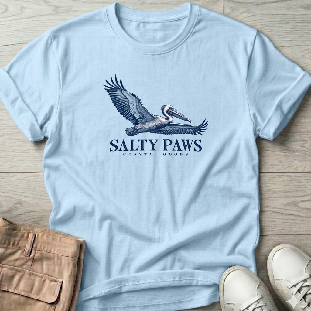 Gliding Pelican Coastal Goods T-Shirt in Light Blue, Salty Paws T-Shirt, front design flat lay
