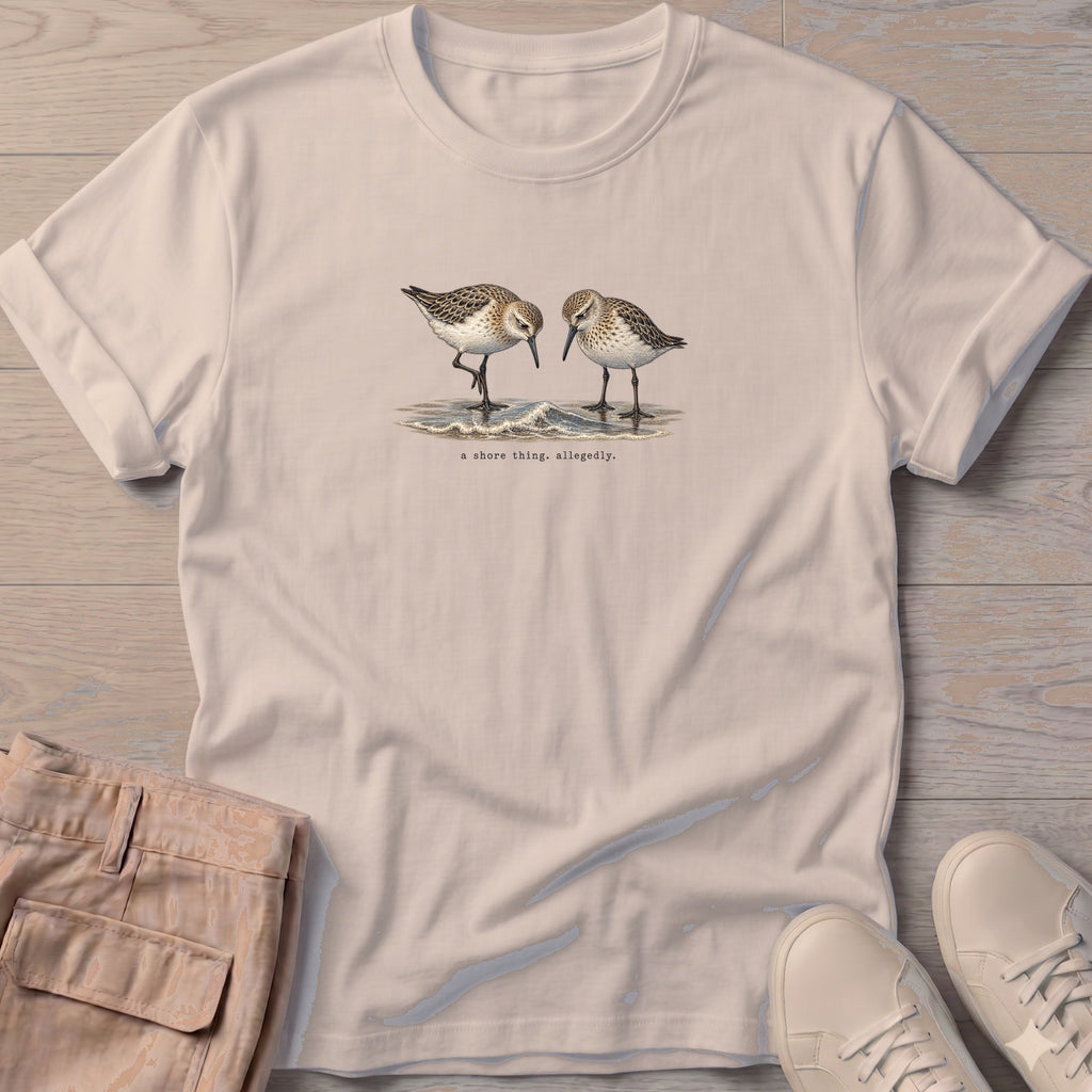 A Shore Thing, Allegedly Sandpipers T-Shirt in Sand, Salty Paws Soft Style T-Shirt, front design flat lay