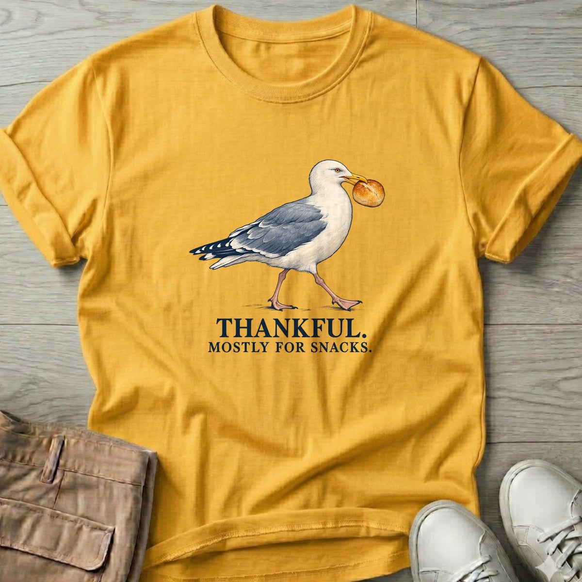 Thankful Mostly for Snacks Seagull T-Shirt in Daisy, Salty Paws T-Shirt, front design flat lay