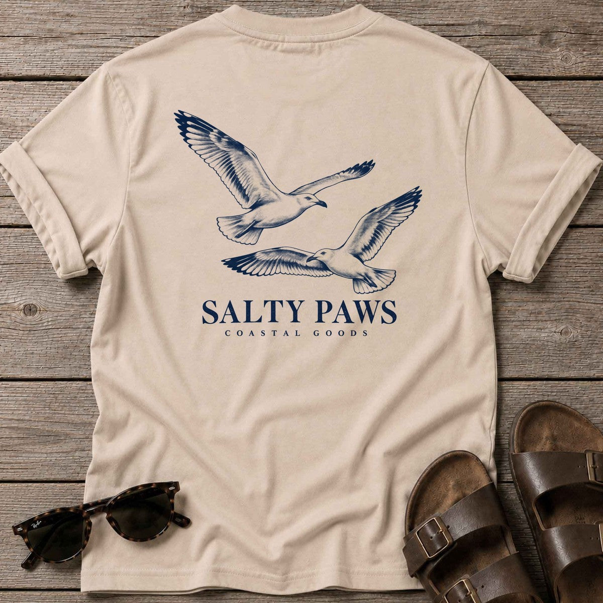 Gull Flight Coastal Goods Back Design T-Shirt in Sand, Salty Paws T-Shirt, back design flat lay