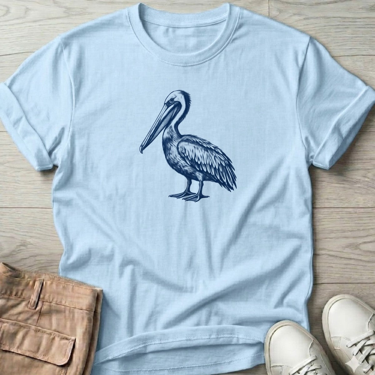 Navy Pelican Portrait T-Shirt in Light Blue, Salty Paws T-Shirt, front design flat lay