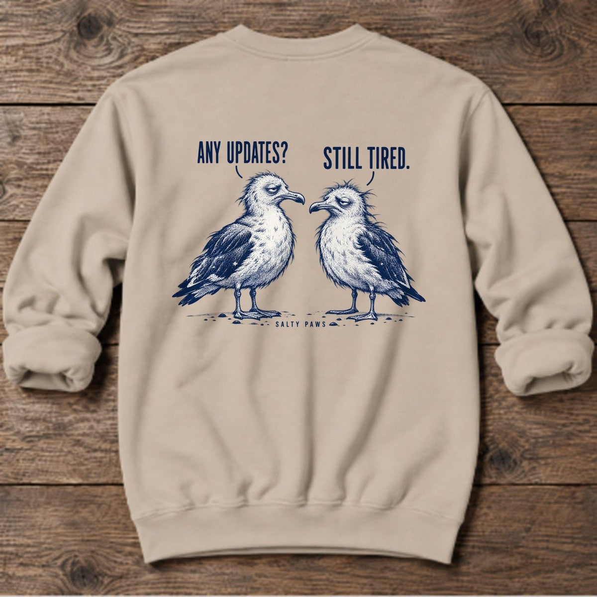 Any Updates Still Tired Seagulls Back Design Midweight Sweatshirt in Sand, Salty Paws Midweight Sweatshirt, back design flat lay