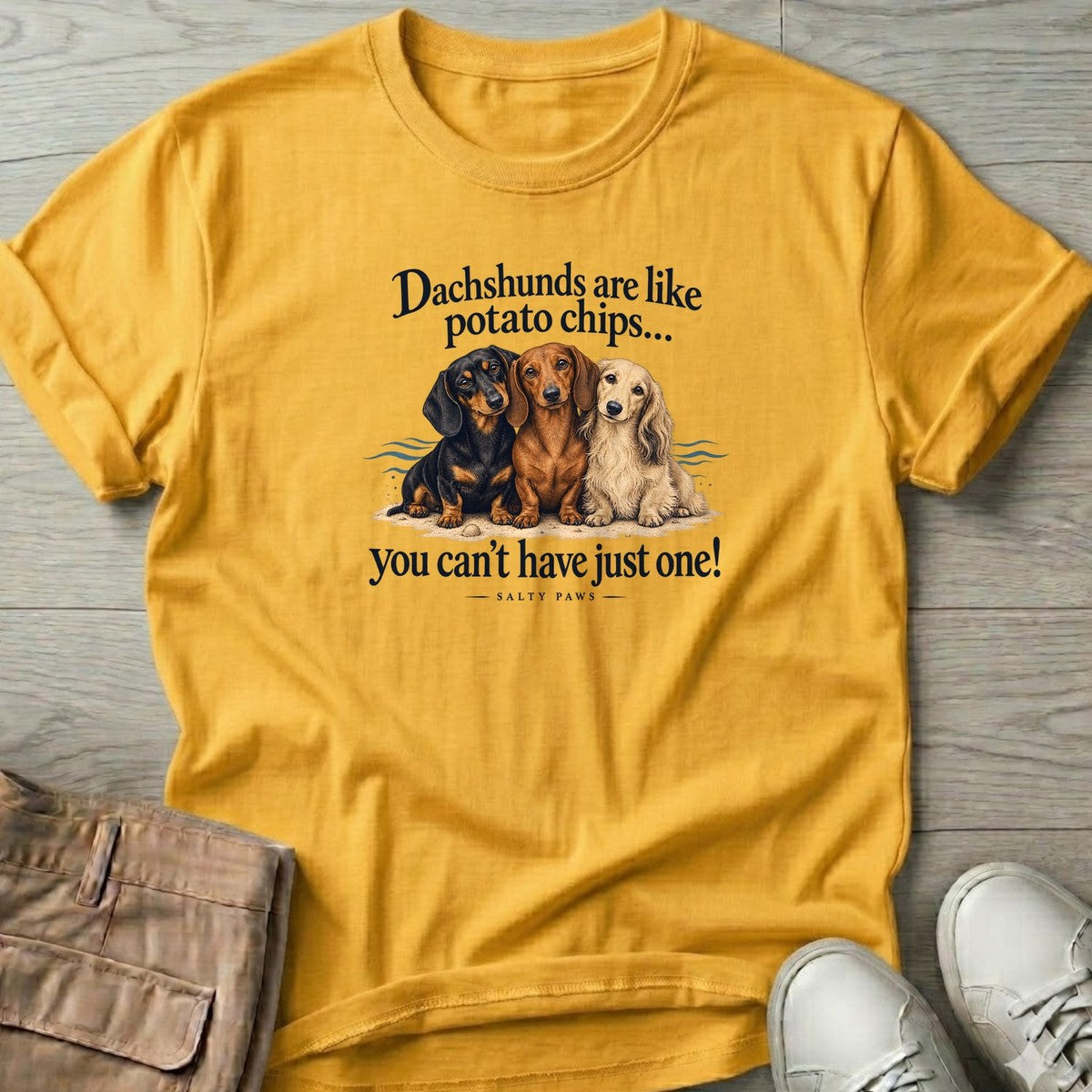 Three Dachshunds Potato Chips T-Shirt in Daisy, Salty Paws T-Shirt, front design flat lay
