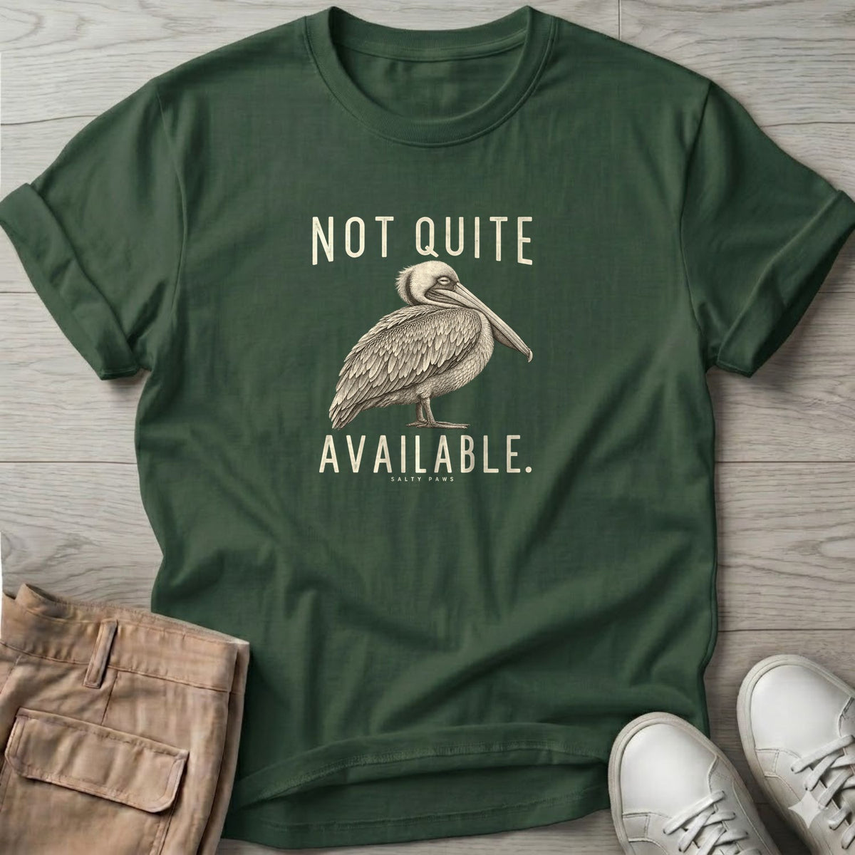 Not Quite Available Pelican T-Shirt in Forest Green, Salty Paws T-Shirt, front design flat lay