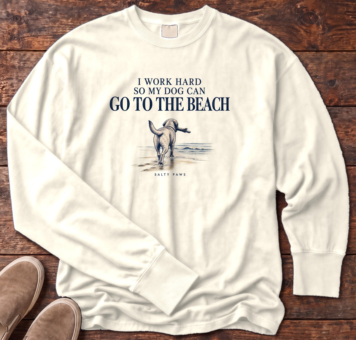 I Work Hard So My Dog Can Go to the Beach Long Sleeve Tee in Ivory, Salty Paws Comfort Colors Long Sleeve Tee, front design flat lay