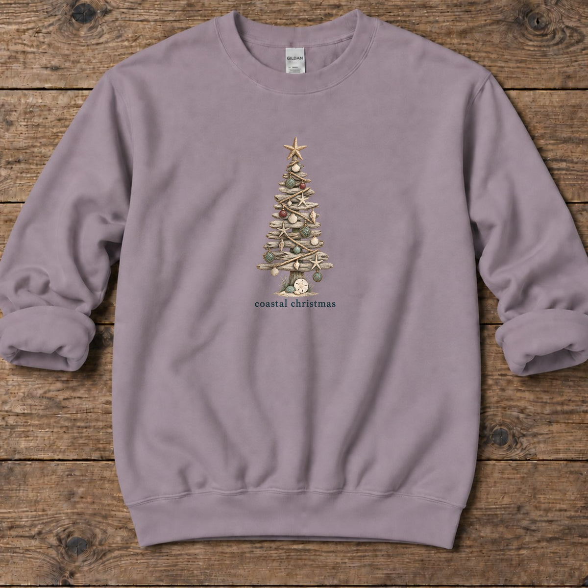 Coastal Christmas Driftwood Tree Midweight Sweatshirt in Paragon, Salty Paws Midweight Sweatshirt, front design flat lay