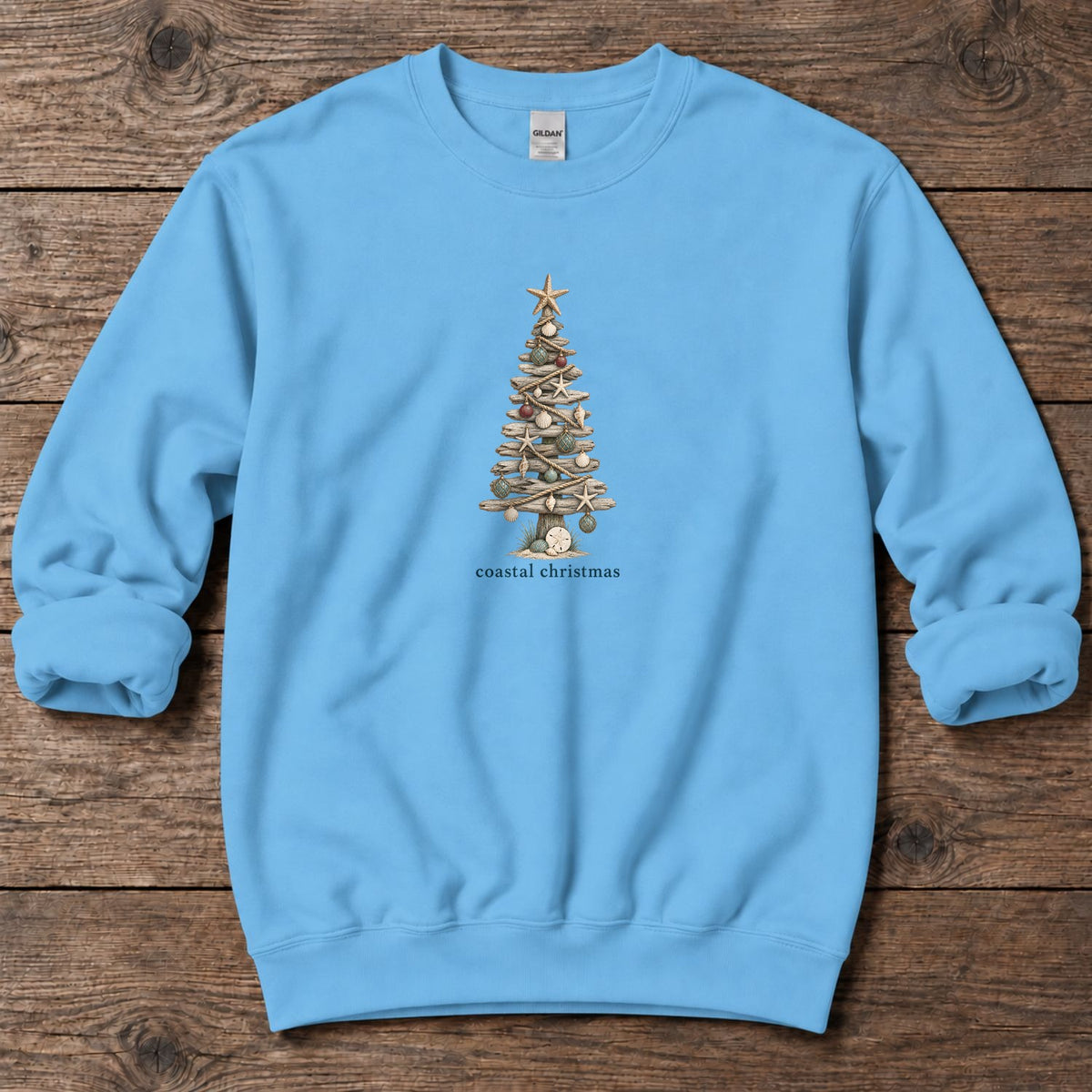 Coastal Christmas Driftwood Tree Midweight Sweatshirt in Sky, Salty Paws Midweight Sweatshirt, front design flat lay