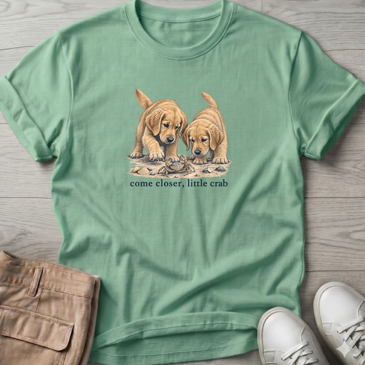 Come Closer Little Crab Golden Puppies T-Shirt in Mint Green, Salty Paws T-Shirt, front design flat lay