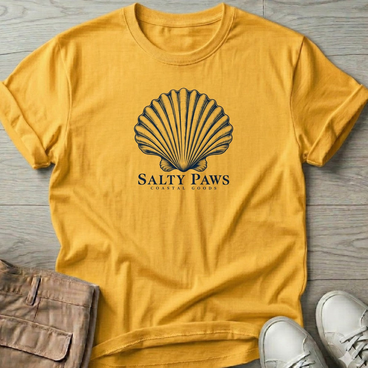 Scallop Shell Coastal Goods T-Shirt in Daisy, Salty Paws T-Shirt, front design flat lay