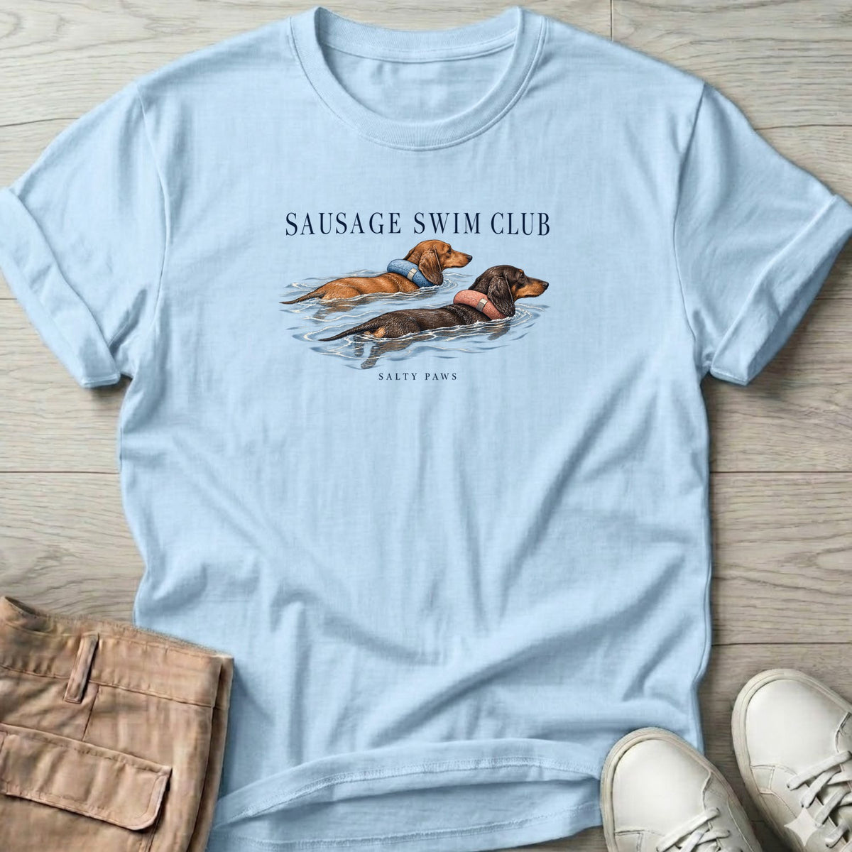 Sausage Swim Club Dachshunds T-Shirt in Light Blue, Salty Paws T-Shirt, front design flat lay