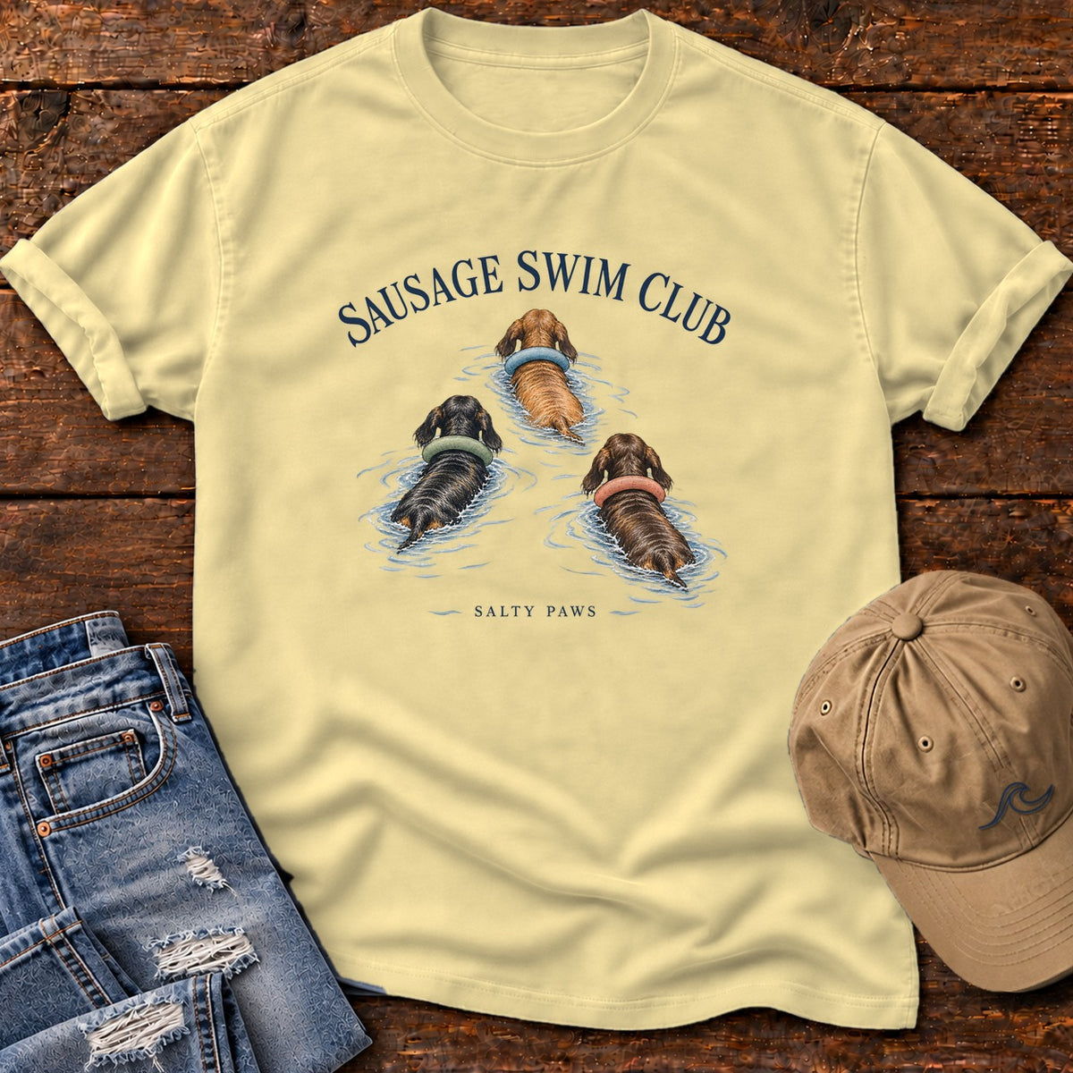 Sausage Swim Club Dachshund Trio T-Shirt in Butter, Salty Paws Comfort Colors T-Shirt, front design flat lay
