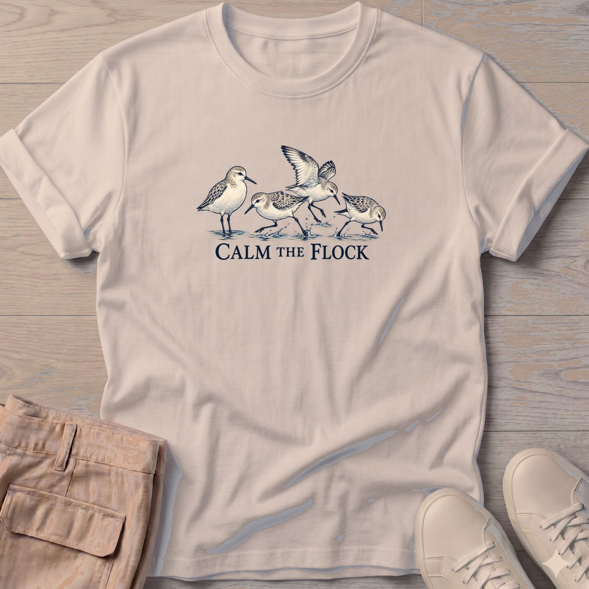 Calm the Flock Sandpipers T-Shirt in Sand, Salty Paws T-Shirt, front design flat lay