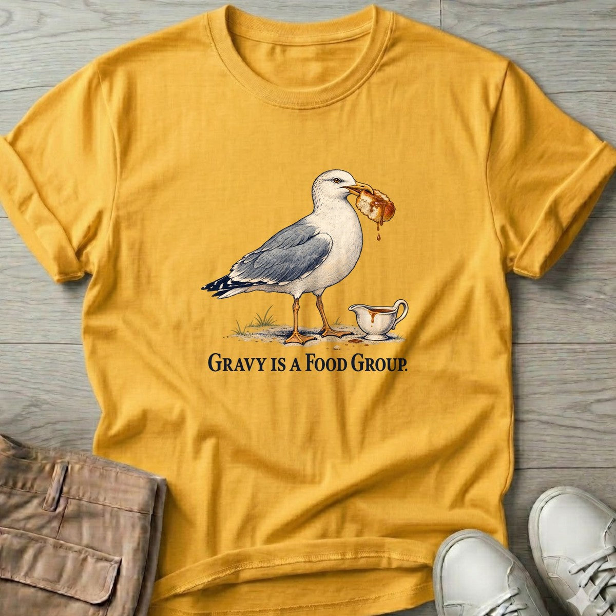Gravy Is a Food Group Seagull T-Shirt in Daisy, Salty Paws T-Shirt, front design flat lay
