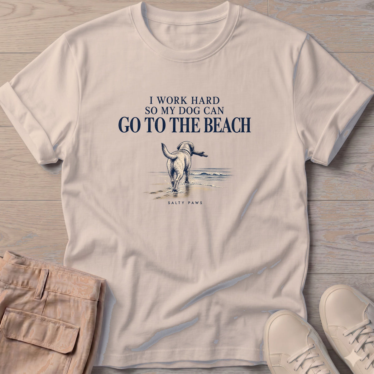 I Work Hard So My Dog Can Go to the Beach T-Shirt in Sand, Salty Paws T-Shirt, front design flat lay