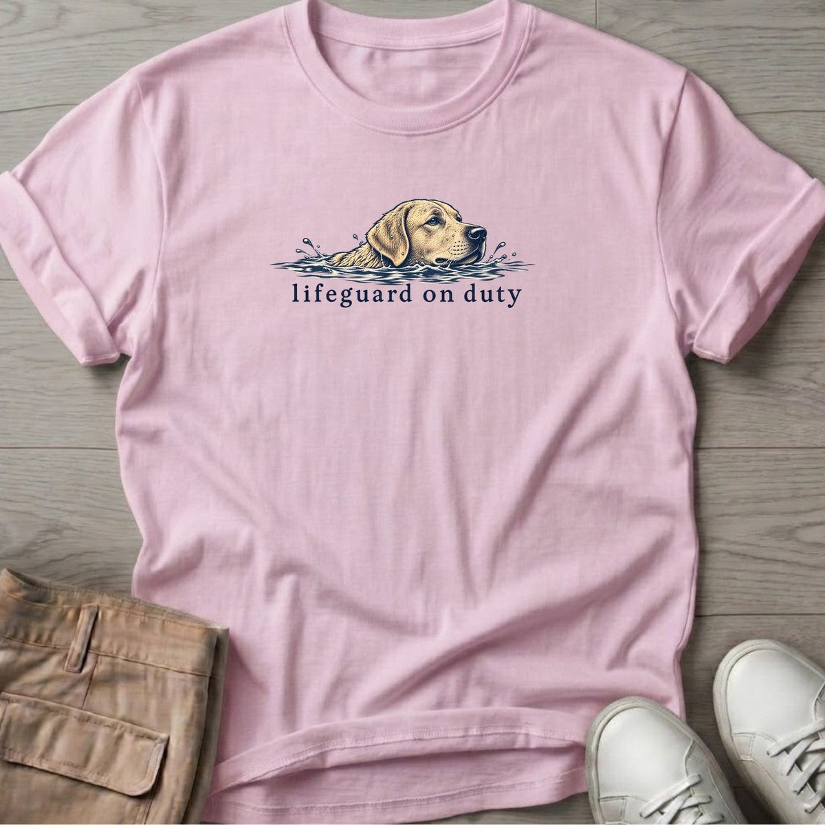 Lifeguard on Duty Yellow Lab T-Shirt in Light Pink, Salty Paws T-Shirt, front design flat lay