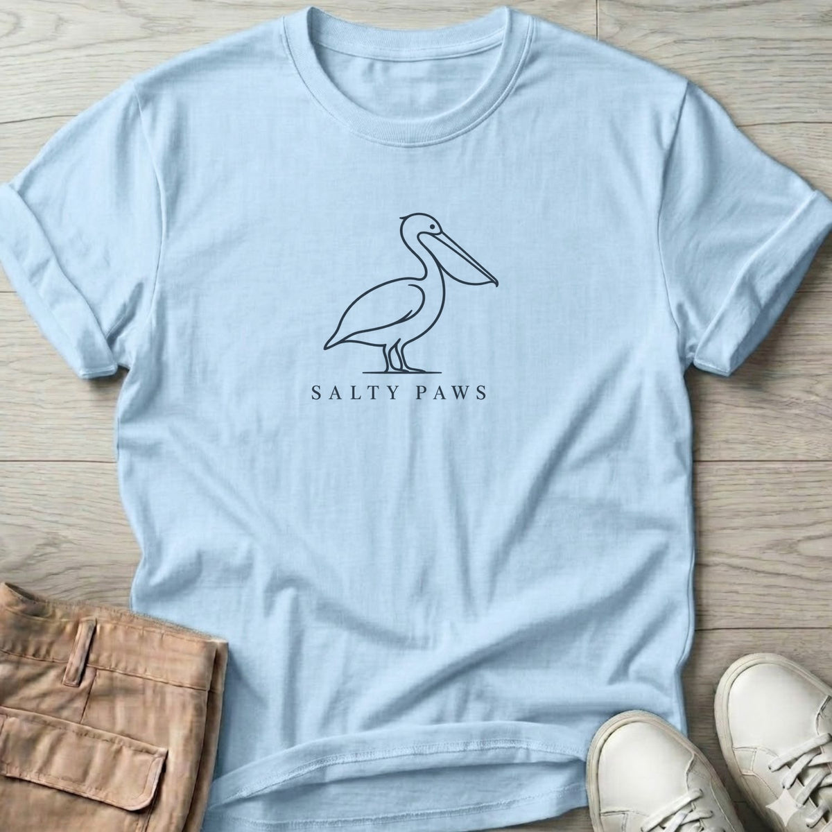 Minimal Pelican Salty Paws T-Shirt in Light Blue, Salty Paws Soft Style T-Shirt, front design flat lay