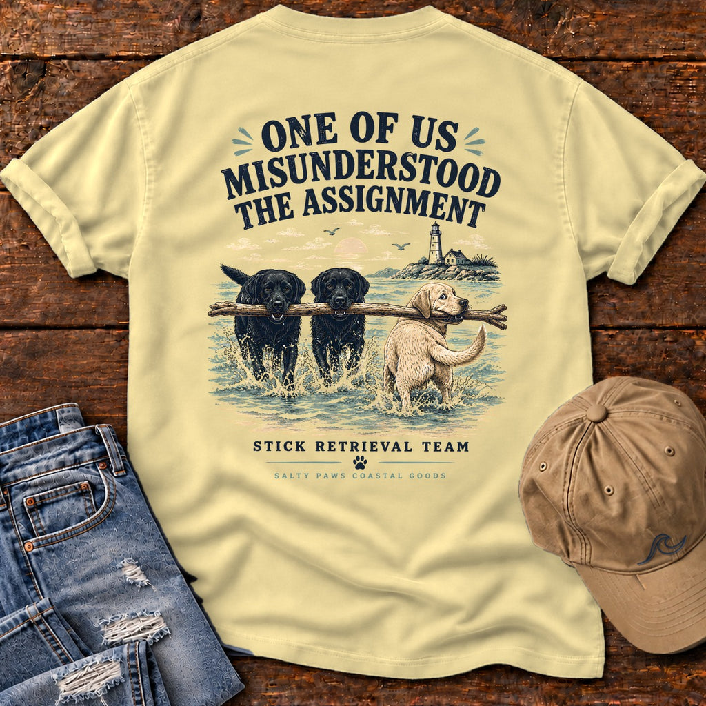 One of Us Misunderstood the Assignment Comfort Colors T-Shirt in Butter, back design flat lay