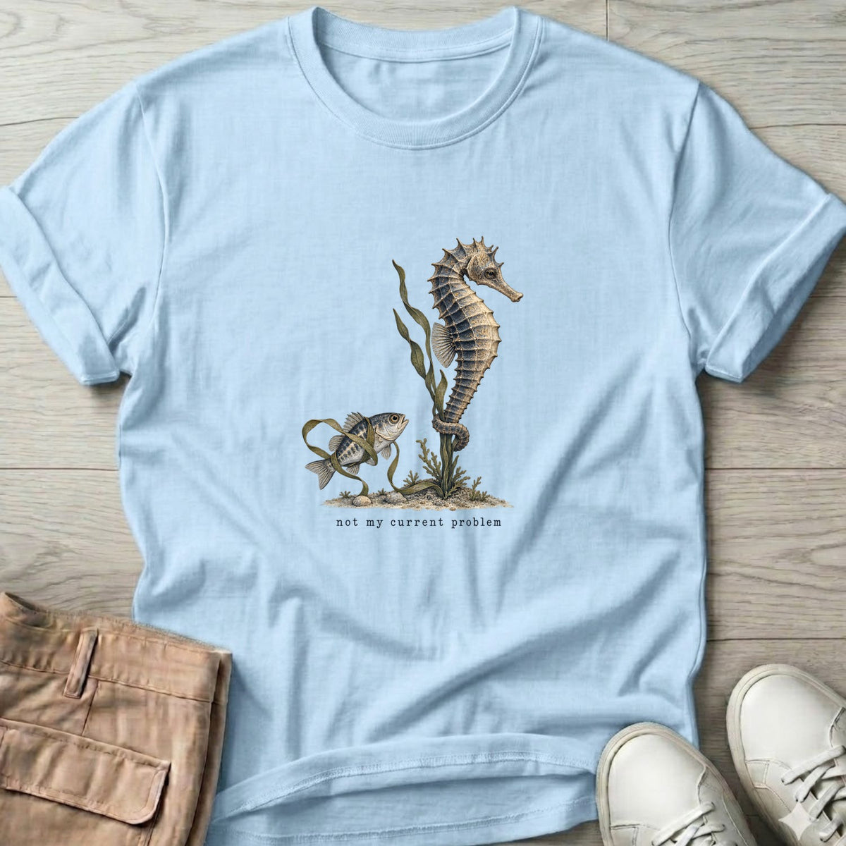 Not My Current Problem Seahorse T-Shirt in Light Blue, Salty Paws Soft Style T-Shirt, front design flat lay