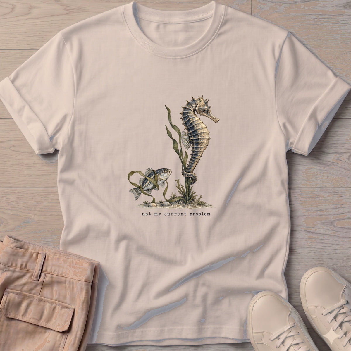 Not My Current Problem Seahorse T-Shirt in Sand, Salty Paws Soft Style T-Shirt, front design flat lay