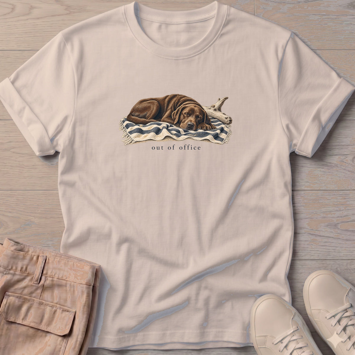 Out of Office Chocolate Labrador T-Shirt in Sand, Salty Paws Soft Style T-Shirt, front design flat lay