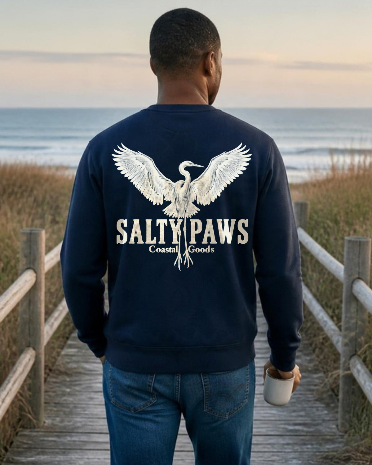 Rising Egret Salty Paws Coastal Goods Back Design Midweight Sweatshirt in Navy, worn by a model, Salty Paws back design